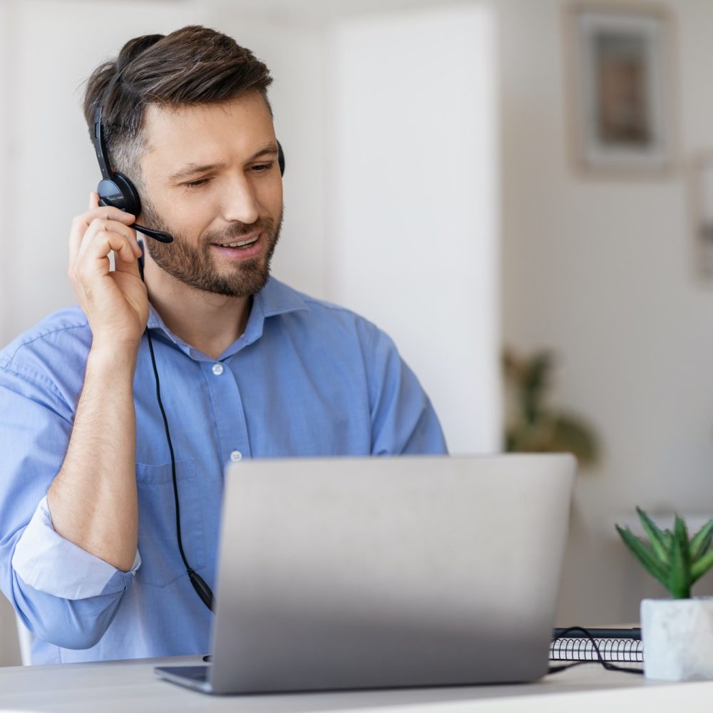 hotline-operator-portrait-of-call-center-employee-wearing-headset-at-workplace-in-office.jpg